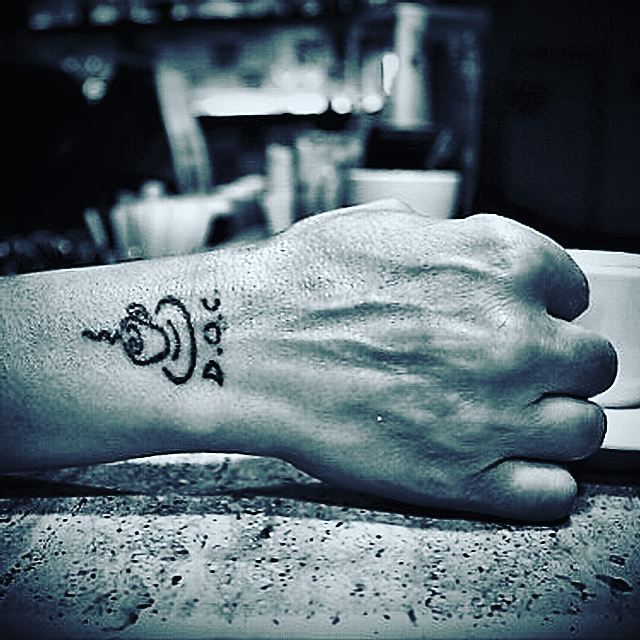 Coffee tattoo barista hand artistry