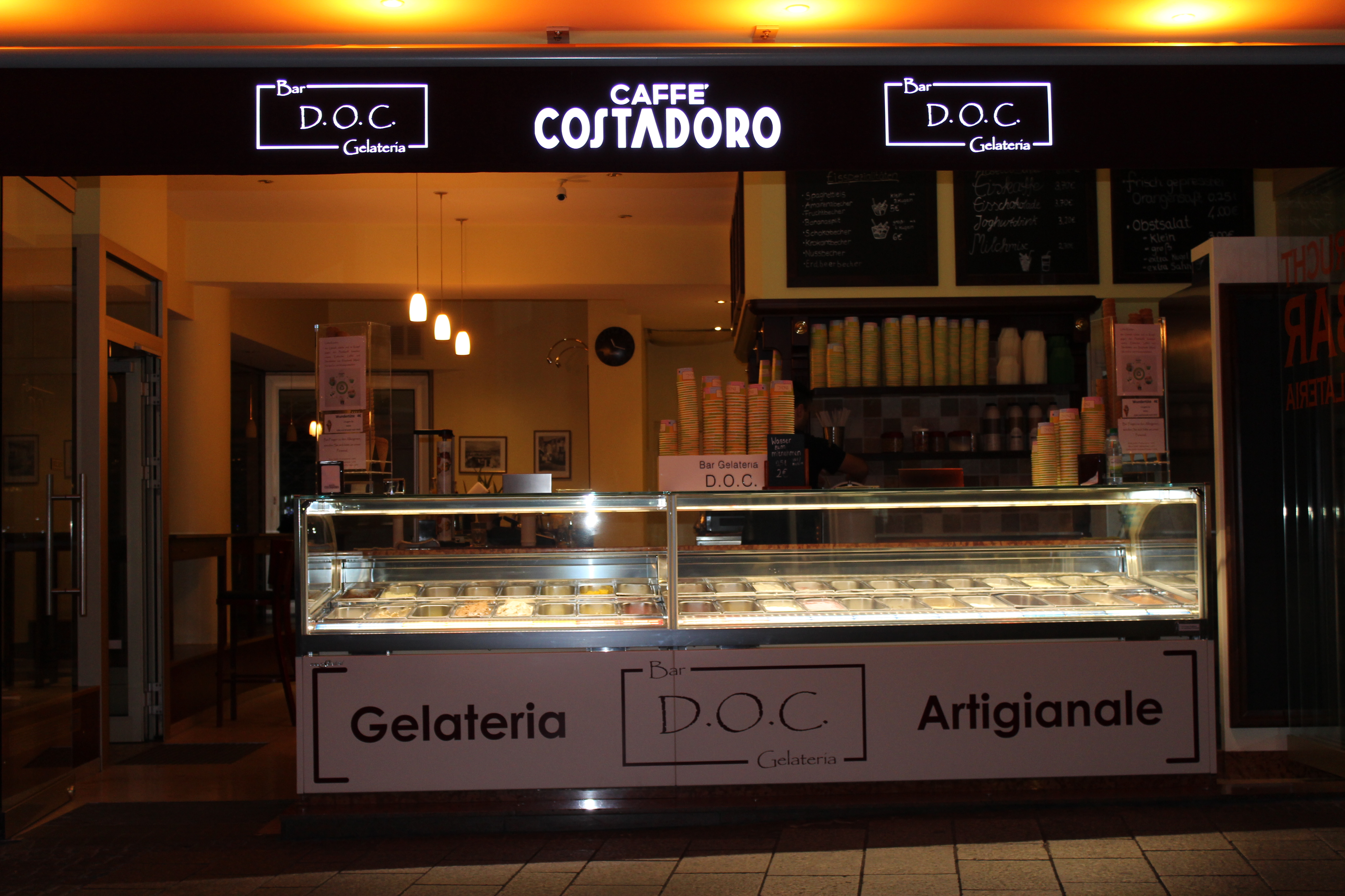 Warm inviting Italian ice bar at night